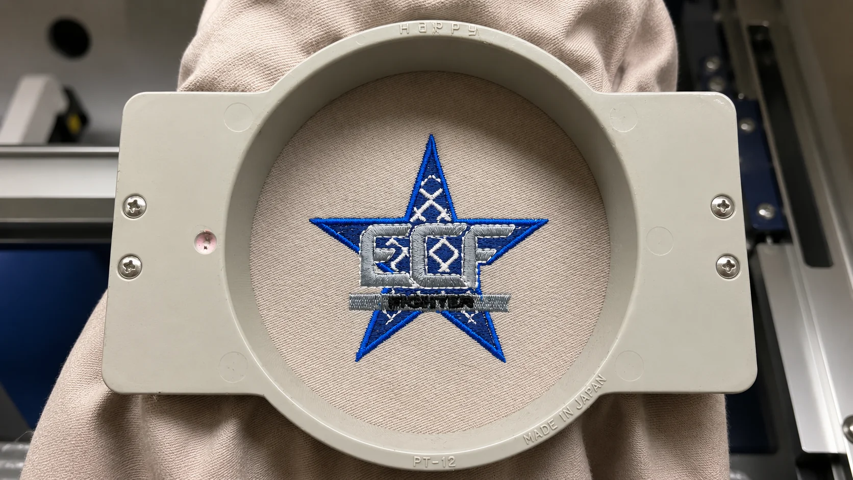 Hooped star logo embroidery in production